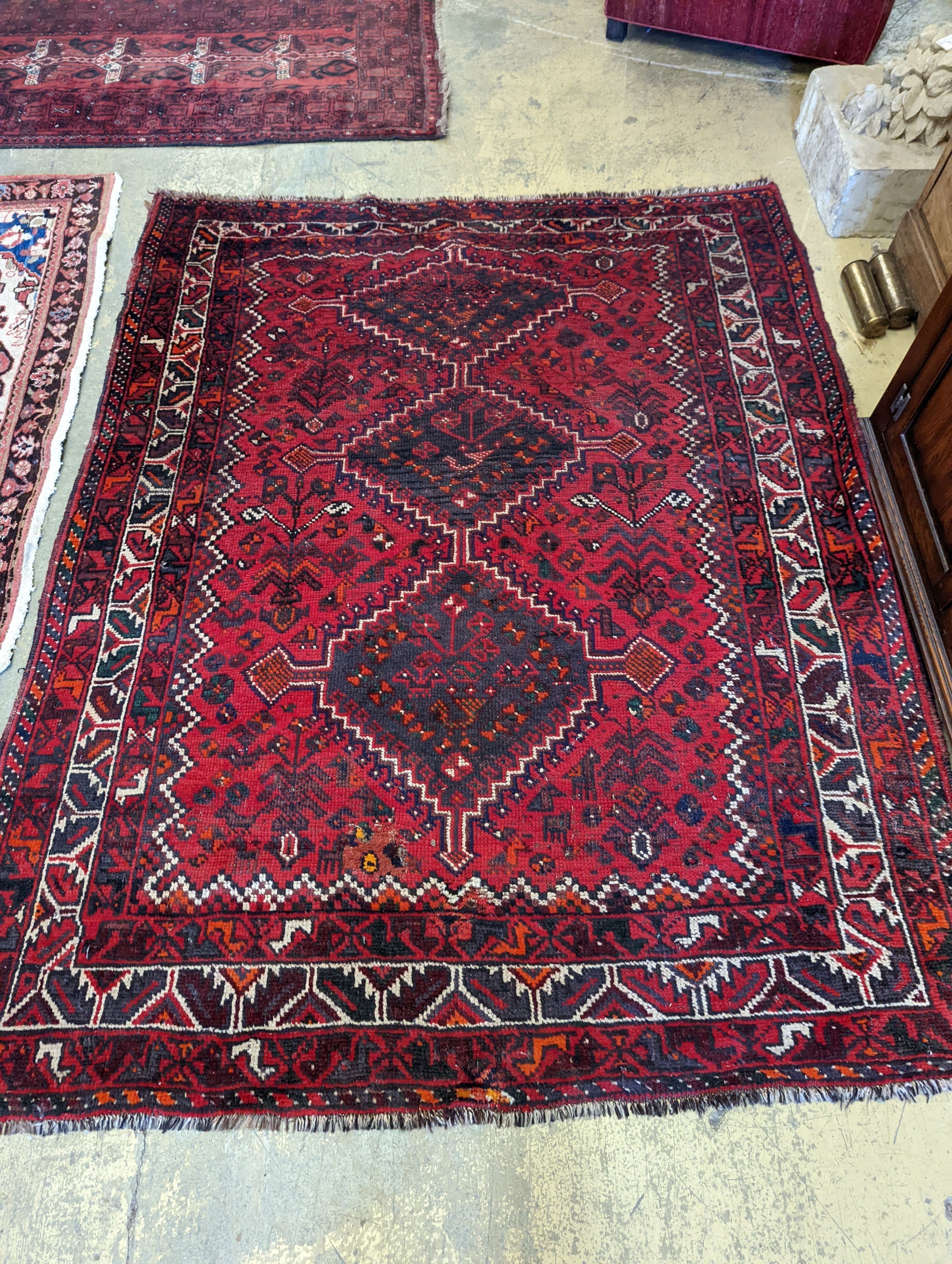 A Caucasian design red ground rug, 200 x 160cm